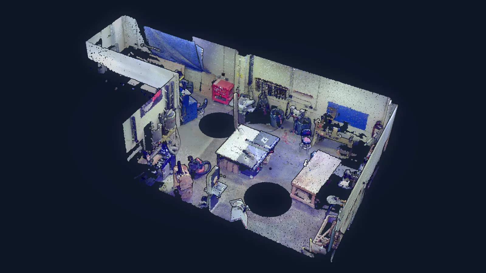 A laser scan of a working lab, desks and machines captured as a coloured point cloud