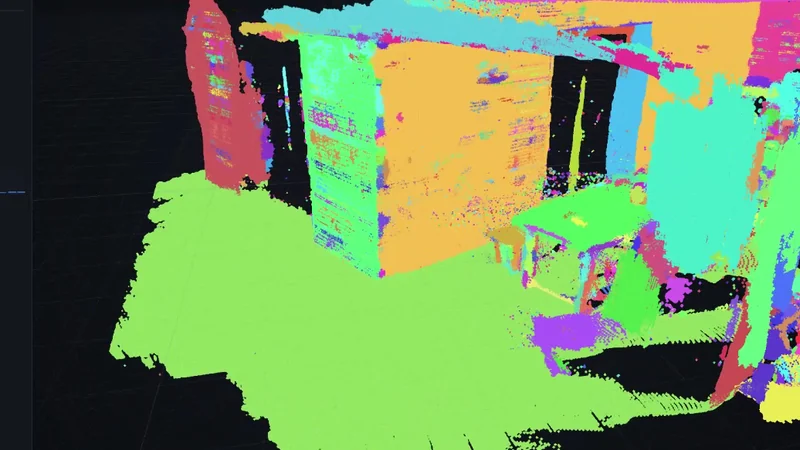 An indoor scan pulled apart by a network that was given no labels at all, each piece it discovered on its own shown in a different colour.