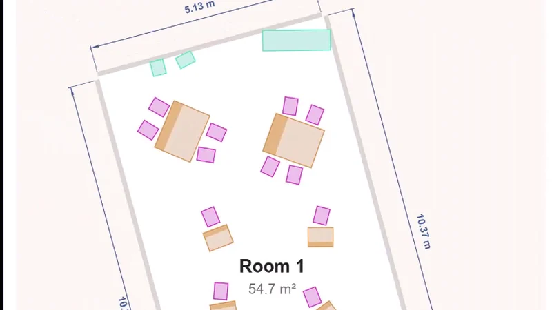 A floor plan drawn straight from a scan, one room measured at 54.7 square metres with its tables and chairs placed and its walls dimensioned.